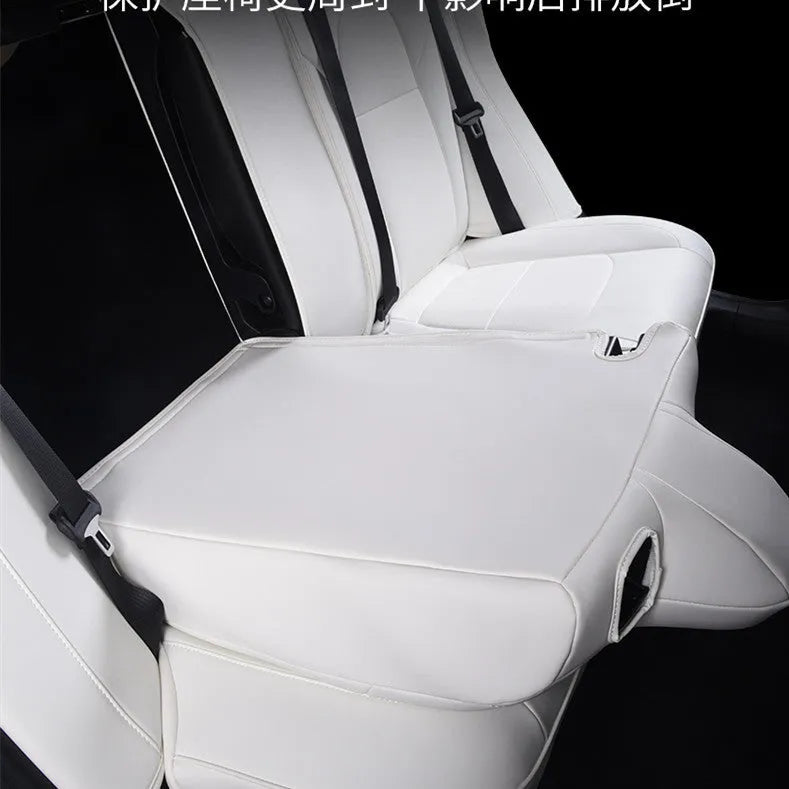 Black PVC car seat cover installed on a Tesla Model 3 front seat