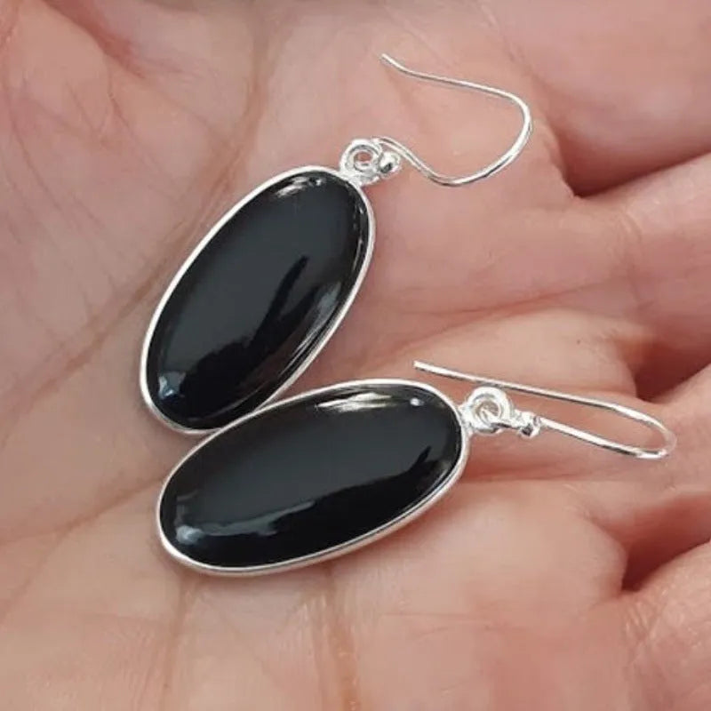 Women's geometric silver earrings with black agate oval pendants on silver chain