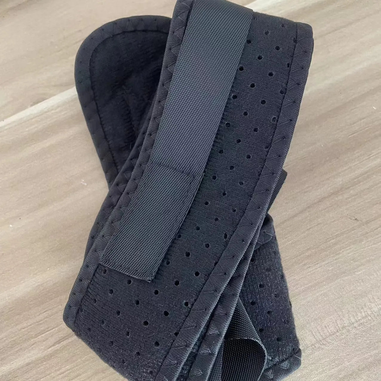 Babaka style nylon back correction posture support belt on a white background.