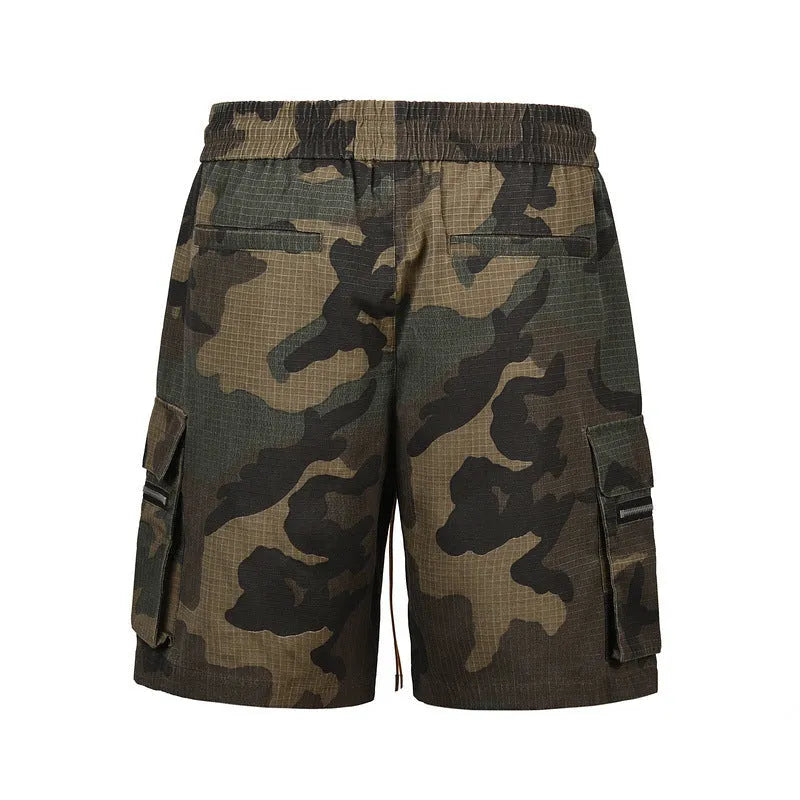 Green H215 cotton camouflage work shorts with multiple bags and a loose, mid-waist fit.