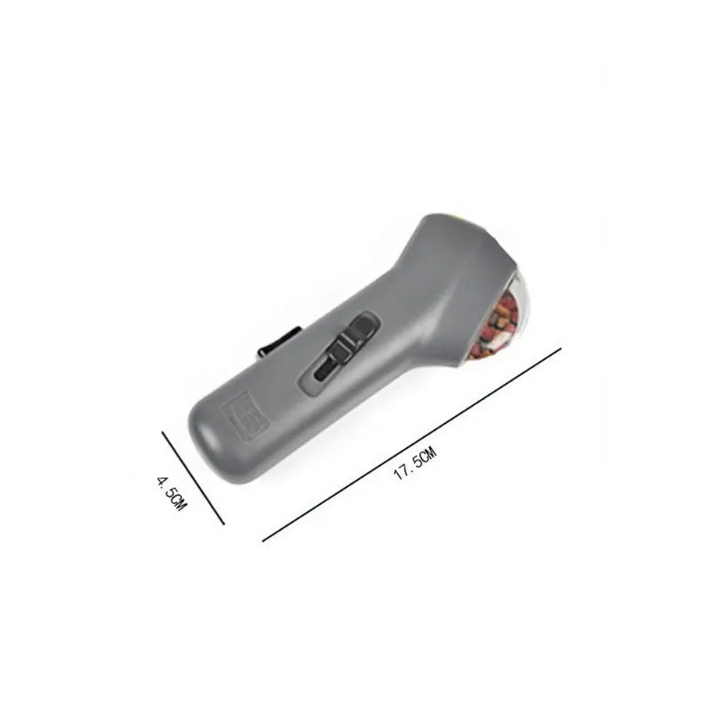 Grey pet snack catapult launcher measuring 18cm with spring trigger for 2-3 metre treat ejection