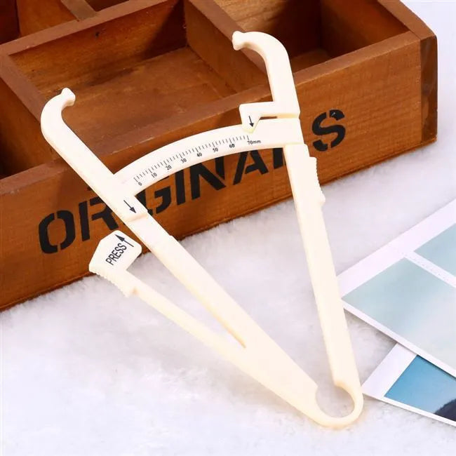 Compact acrylic body fat caliper showing measurement scale up to 200mm on a white background.