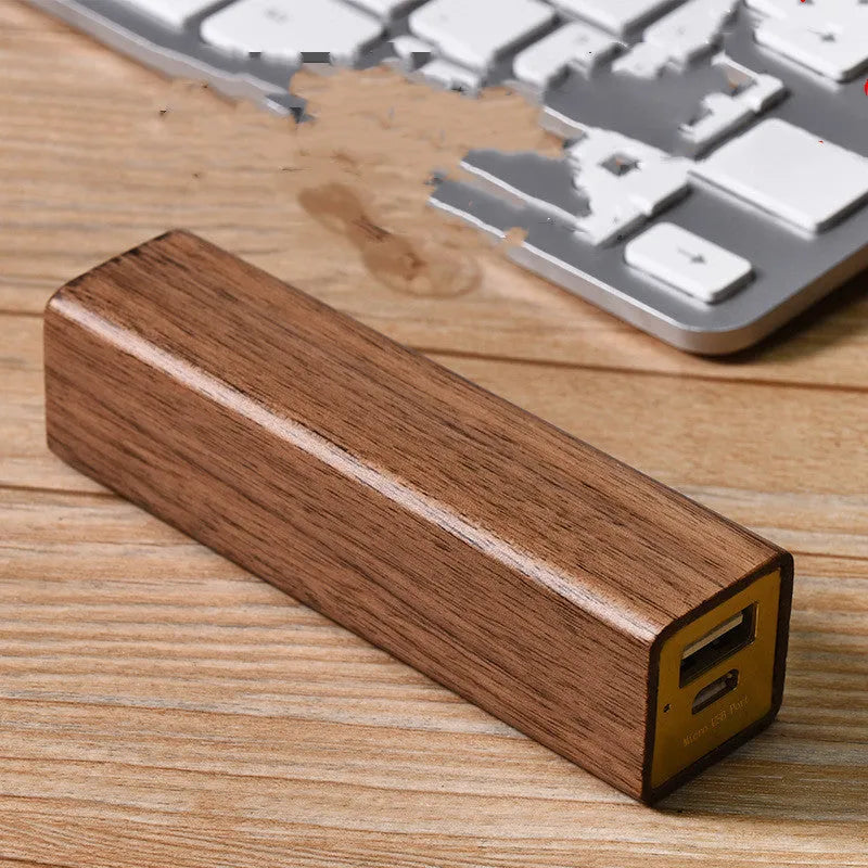 Brown walnut wood portable power bank with 2000mAh capacity and gift box packaging.