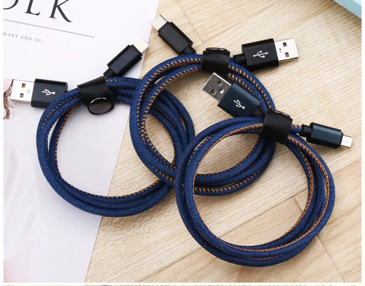 Cowboy-style denim USB-C charging cable with aluminium connectors in black, blue, or red.