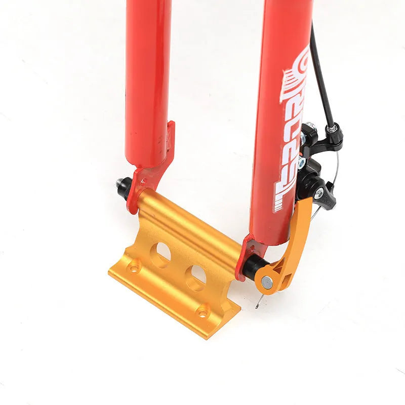 Silver metal quick release fixing clip for bicycle front fork on a white background.