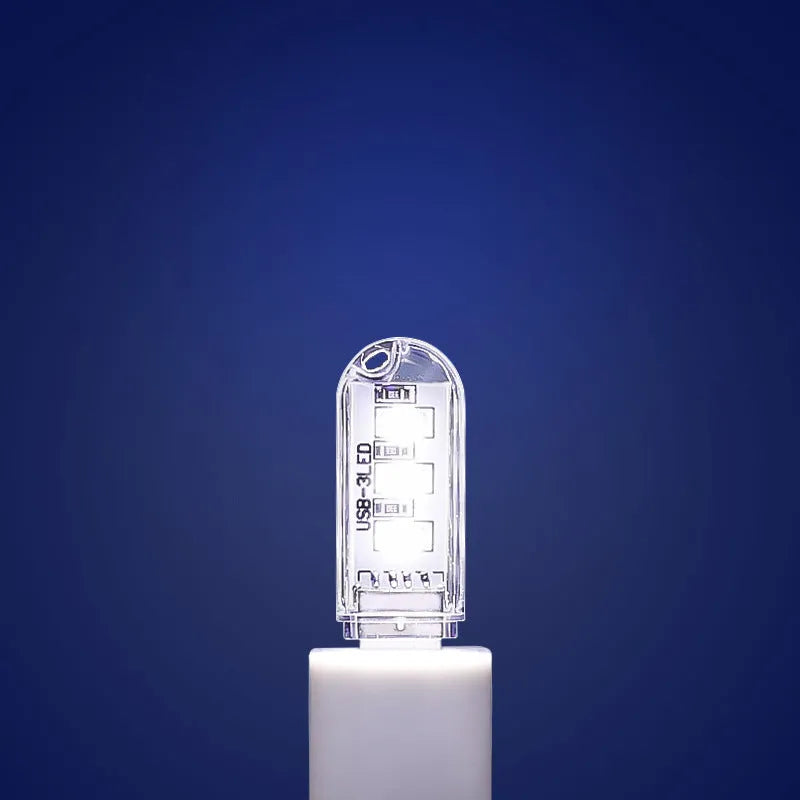 Small white USB baby night light with eye protection feature showing warm and white light options