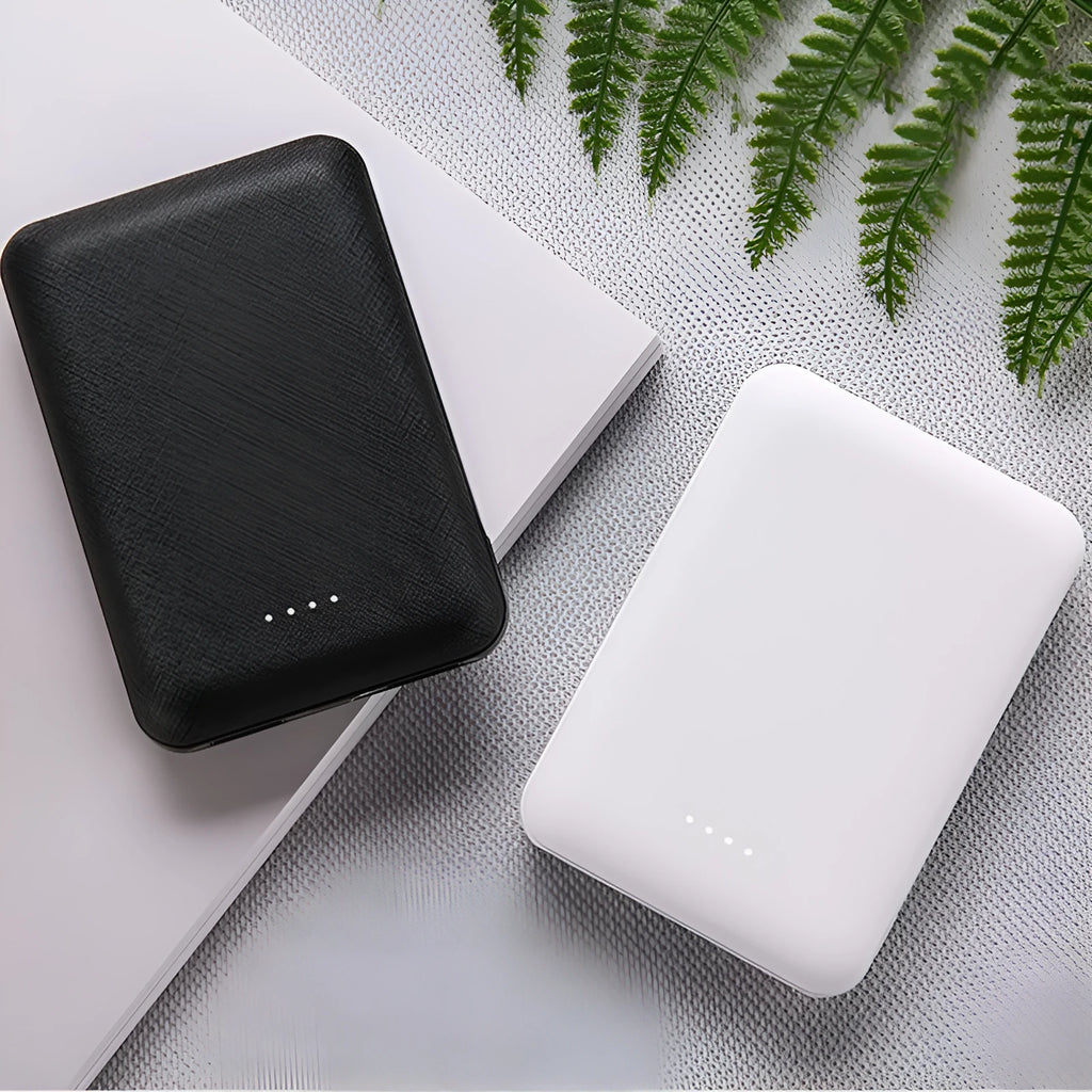 Black ultra-thin 10,000mAh power bank showing multi-U port output and compact 90mm x 63mm dimensions