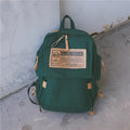 Korean canvas backpack in black with rain cover, double shoulder straps, and zipped internal pockets for travel and campus use