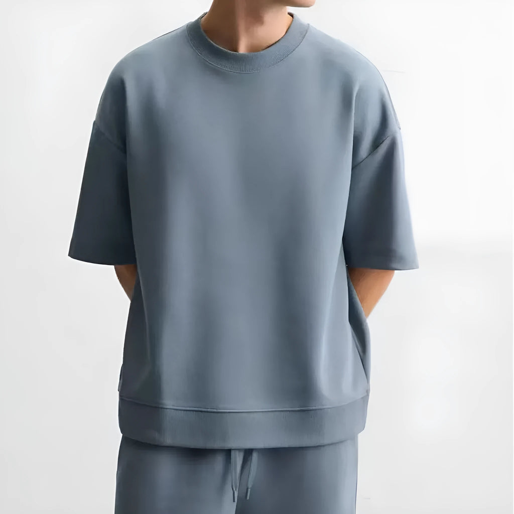 Loose double-sided texture polyester top and matching shorts casual set shown in blue.