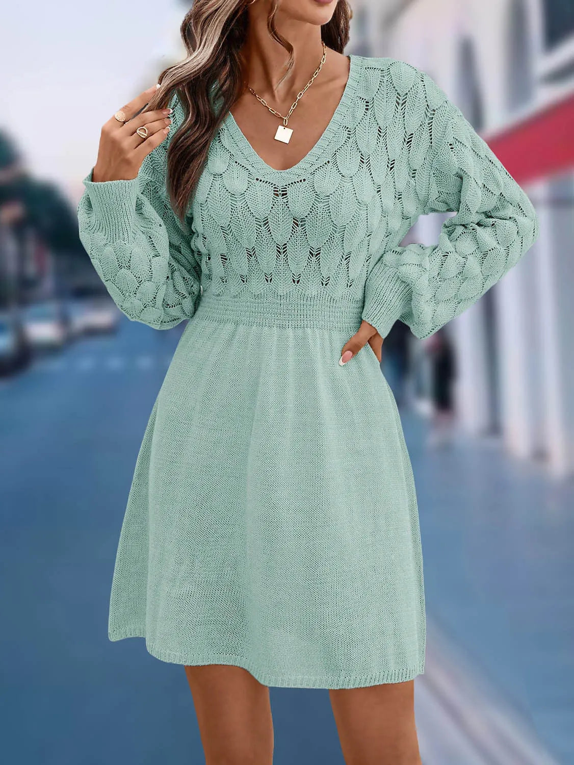 Ethnic style V-neck long sleeve beach dress with high waist and artistic 3D pattern in apricot colour.