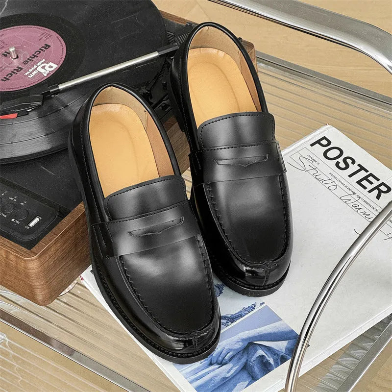 Black men's slip-on derby leather shoes with a rubber sole on a white background