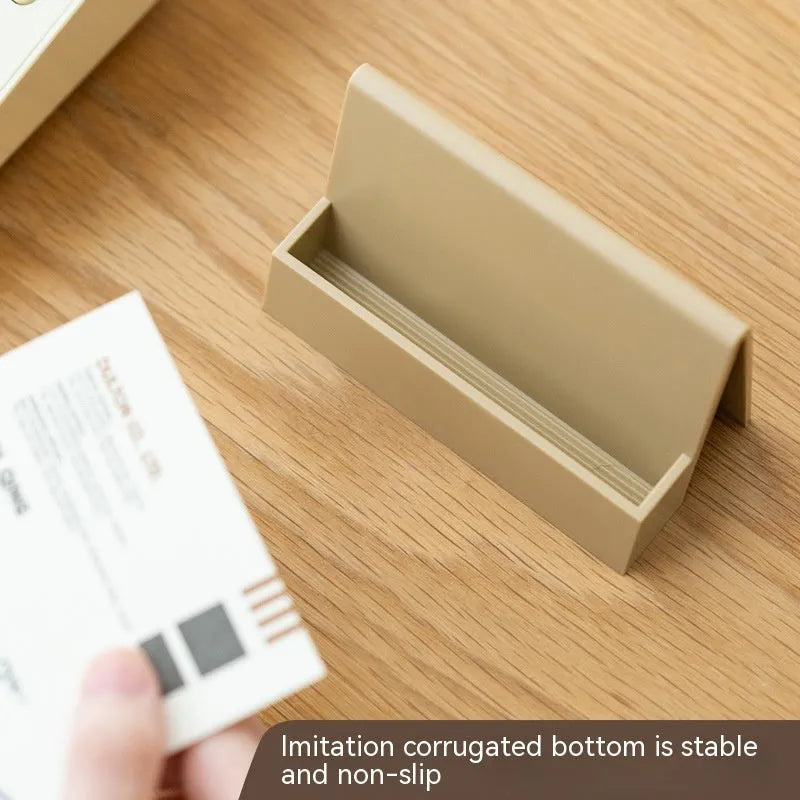 Geometric PS plastic business card stand with 20 slots in brown on a desk