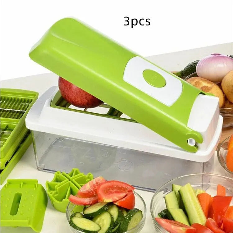 Green manual vegetable chopper with stainless steel blades on a kitchen counter