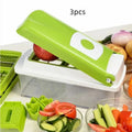 Green manual vegetable chopper with stainless steel blades on a kitchen counter