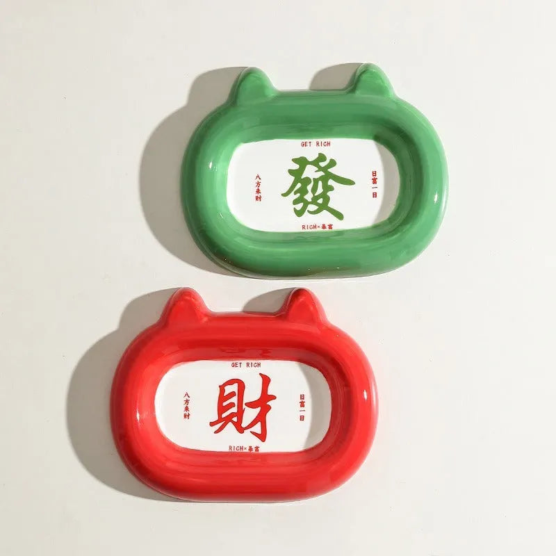 Ceramic pet bowl with a raised animal motif design on the side, shown in one of six available themes.