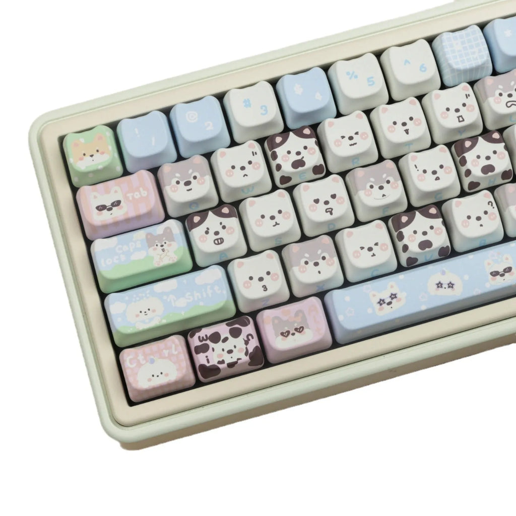 PBT sublimation keycap set showing cat and puppy character designs on mechanical keyboard keys