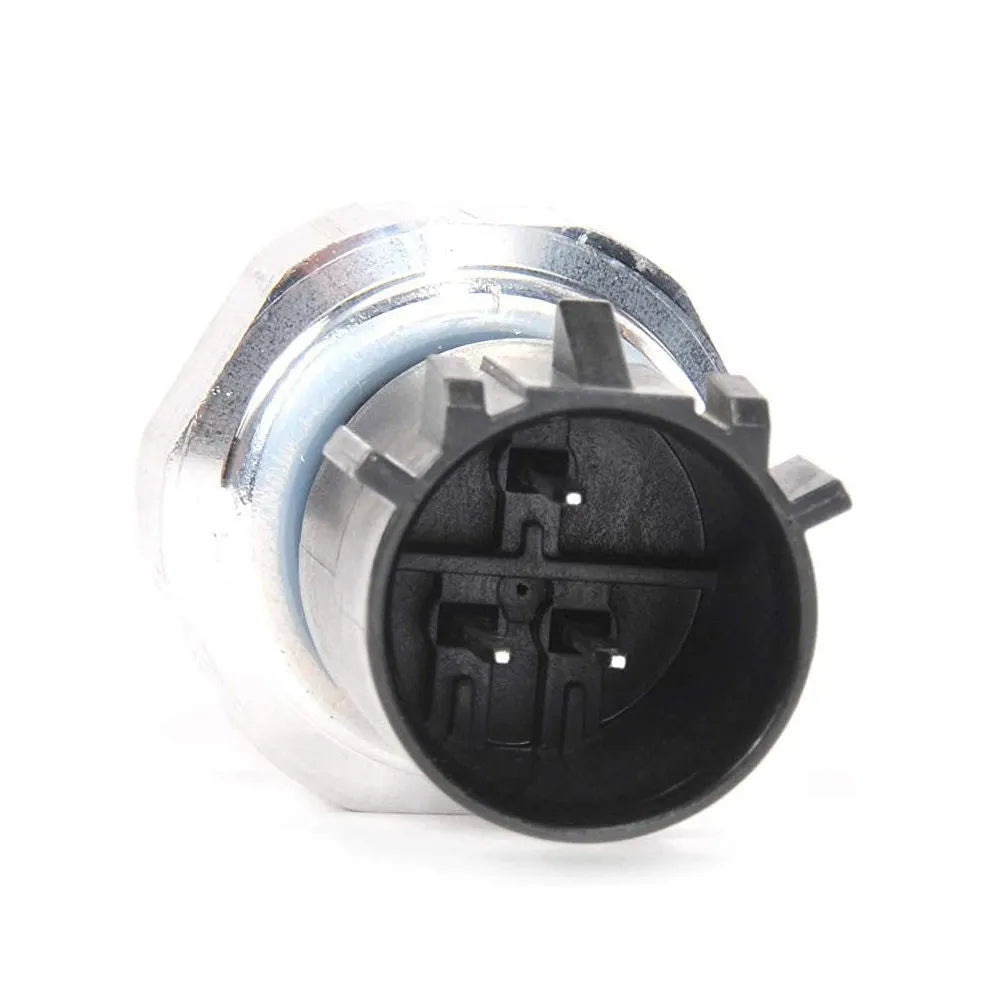 Silver automobile fuel pressure sensor replacement part on white background.