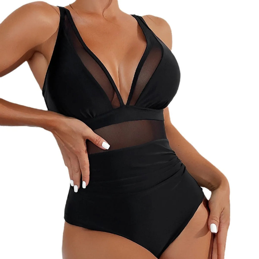 Black women's one-piece swimsuit with halter neck and briefs-style bottom made of nylon.