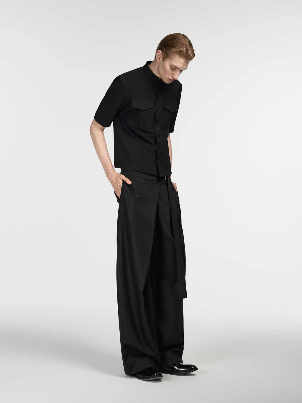 Black straight-leg trousers with adjustable waistband and single pleat design in Tencel cotton fabric