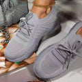 Women's solid colour platform lace-up flying knitted sneakers in white with round toe and wedge heel