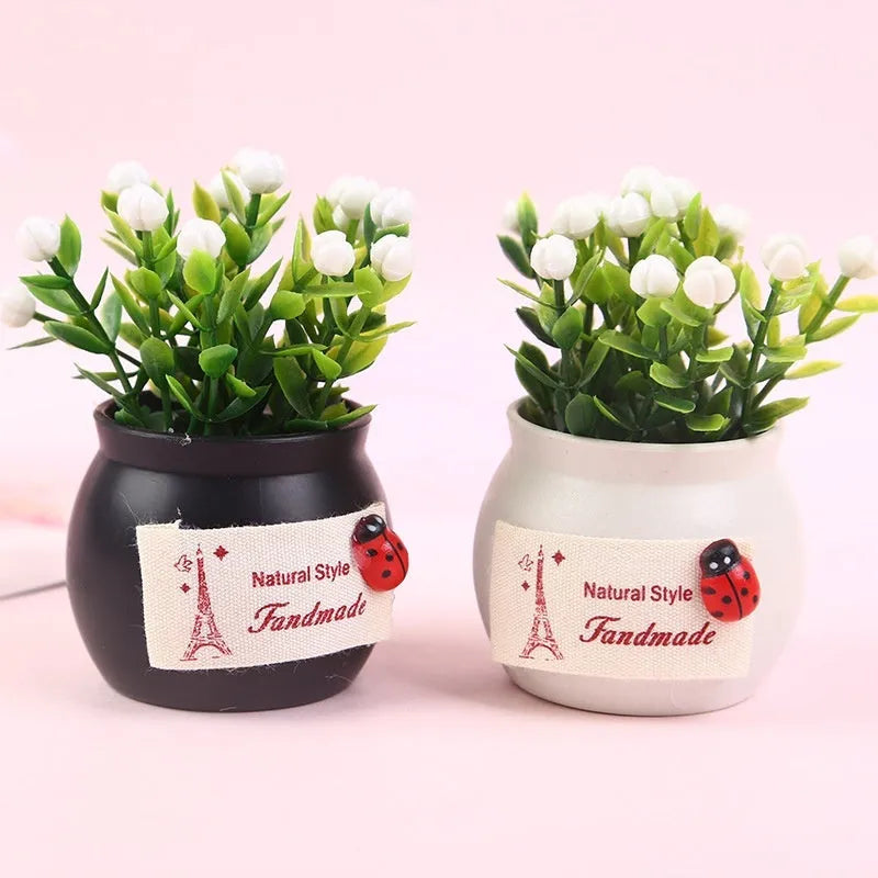 Auspicious fruit potted plant car ornament in a plastic vase, available in black or white, for car interior decoration and odour removal