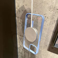 Transparent acrylic MagSafe phone case for iPhone Pro models showing magnetic functionality
