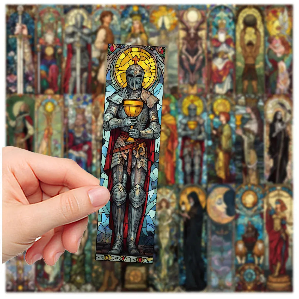 Set of 30 handmade paper tarot bookmarks with painted glass card designs.