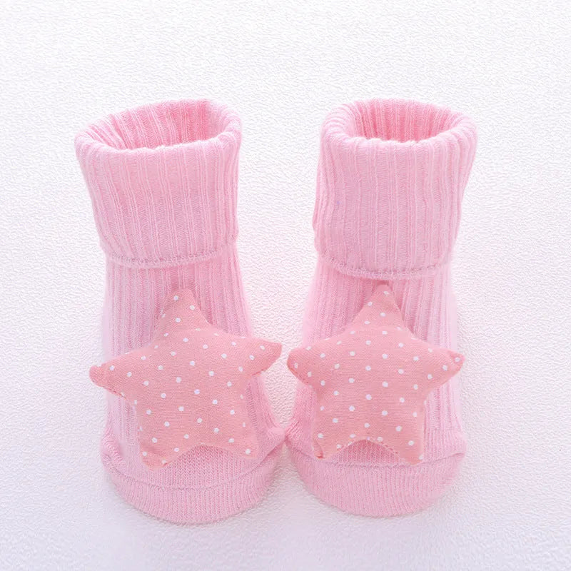Cotton baby floor socks in various colours and patterns including bows, stars, and animal designs