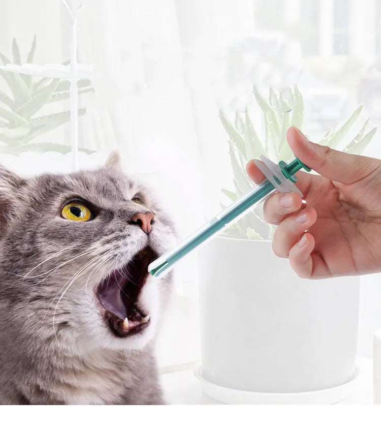 Two pet pill shooter syringes with soft tips, one larger and one smaller, for administering medication to cats and dogs.
