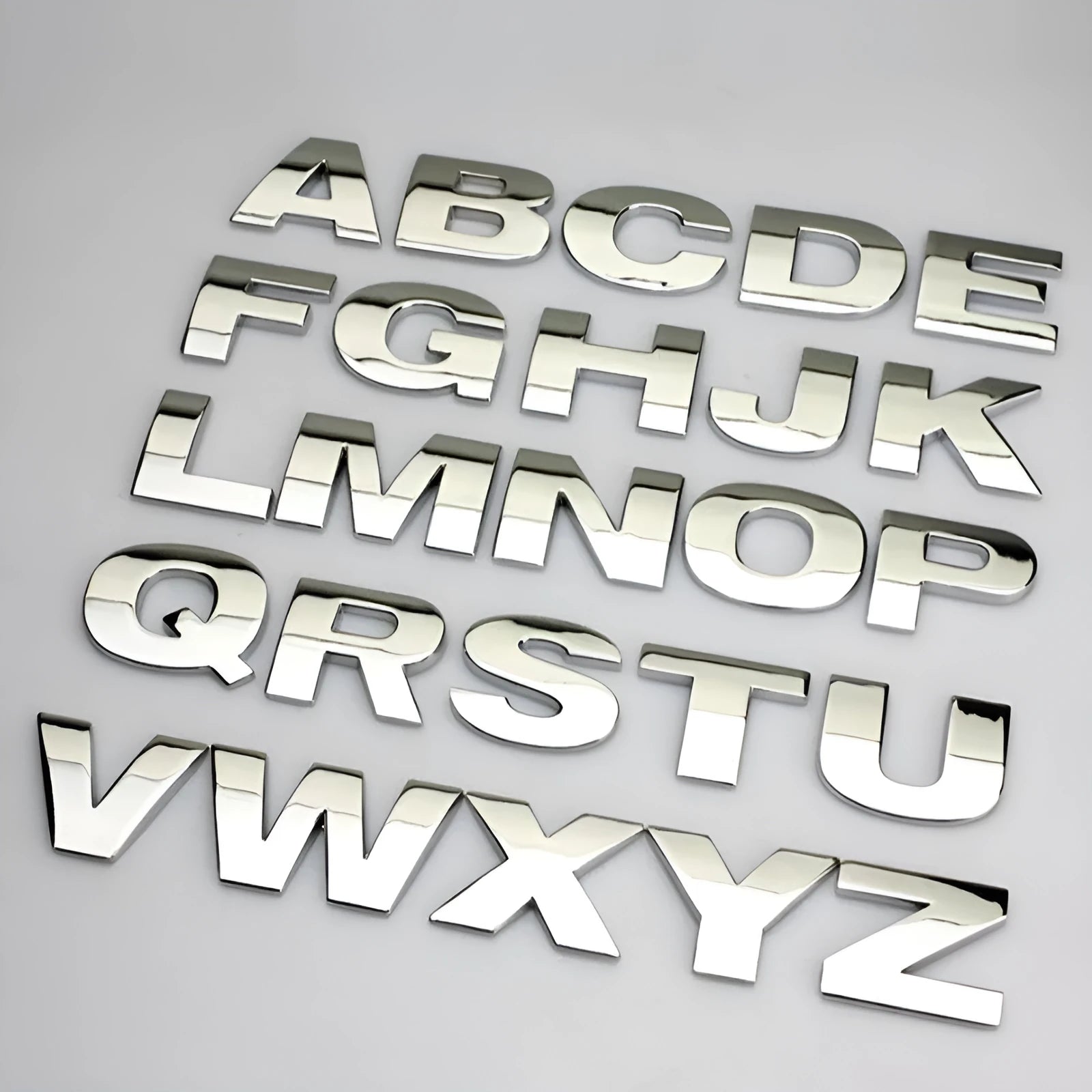 Zinc alloy metal car letter sticker in black or silver, 2.5cm size, for vehicle personalisation.