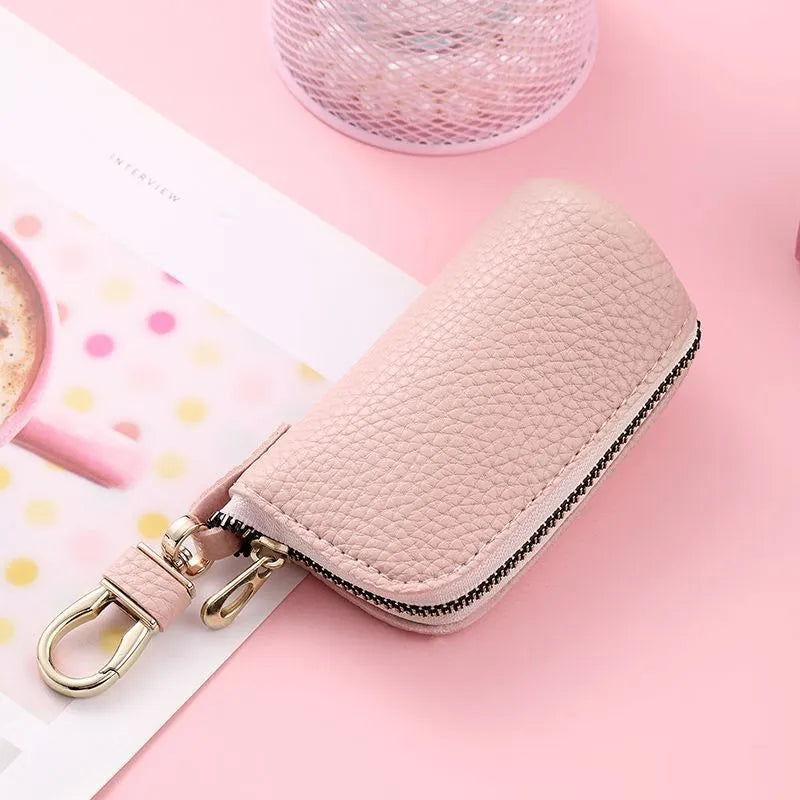 Minimalist waterproof PU leather key case with zipper closure in black, grey, and pink colours