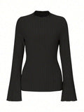 Long sleeve round neck pullover in black with lantern sleeves and a subtle sunken stripe pattern.