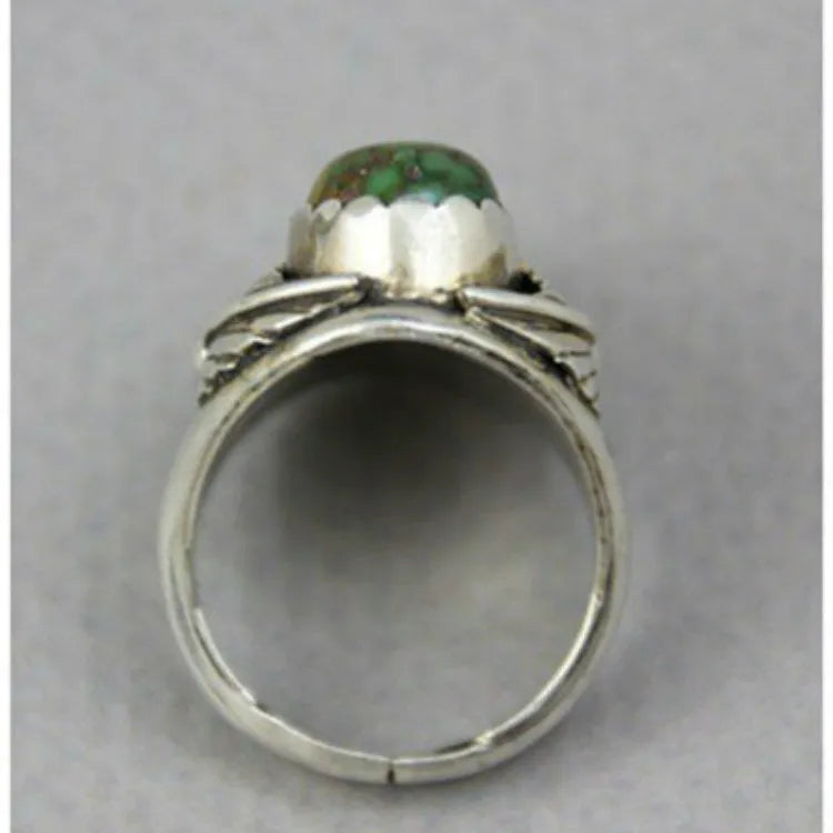 Retro geometric women's ring with a turquoise colour inlay on an electroplated alloy band.