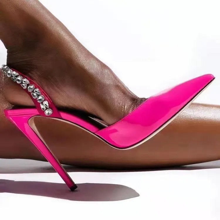 Women's black patent leather pointed toe high heel sandals with rhinestone side detail, shown on a white background.