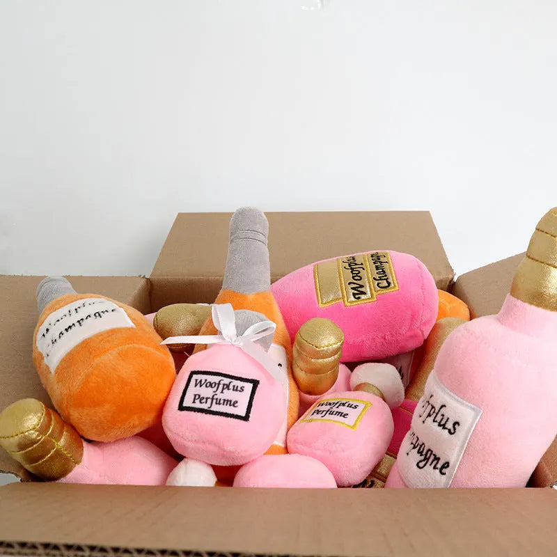 Soft plush dog toy shaped like a colourful wine bottle for gentle chew play.