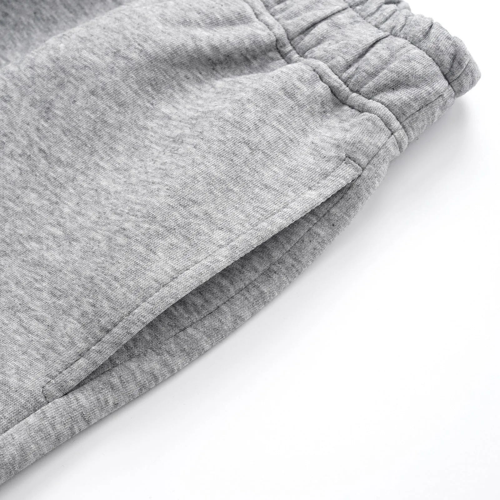 Men's solid colour cotton straight leg trousers with a loose wide-leg casual fit on a hanger.