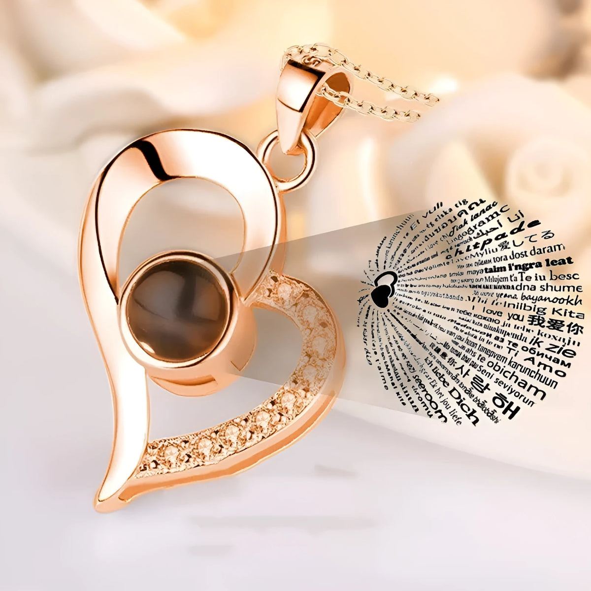Rose gold heart-shaped projection necklace in copper with O chain, displaying 100 languages love message.