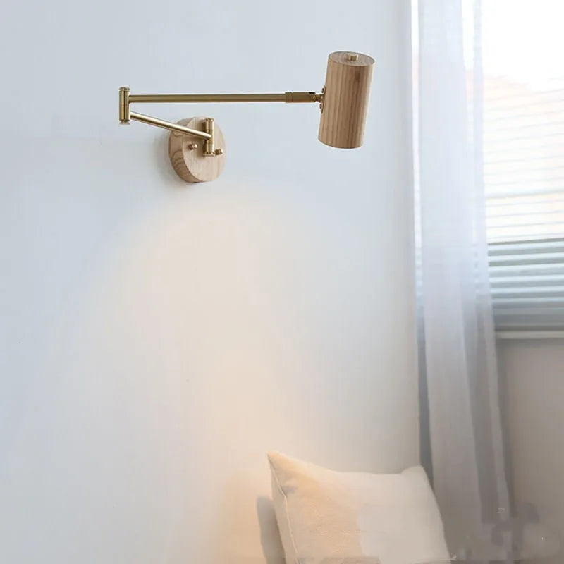 Retro wooden wall lamp with rotating spot light head and long arm, showing cord with built-in switch.