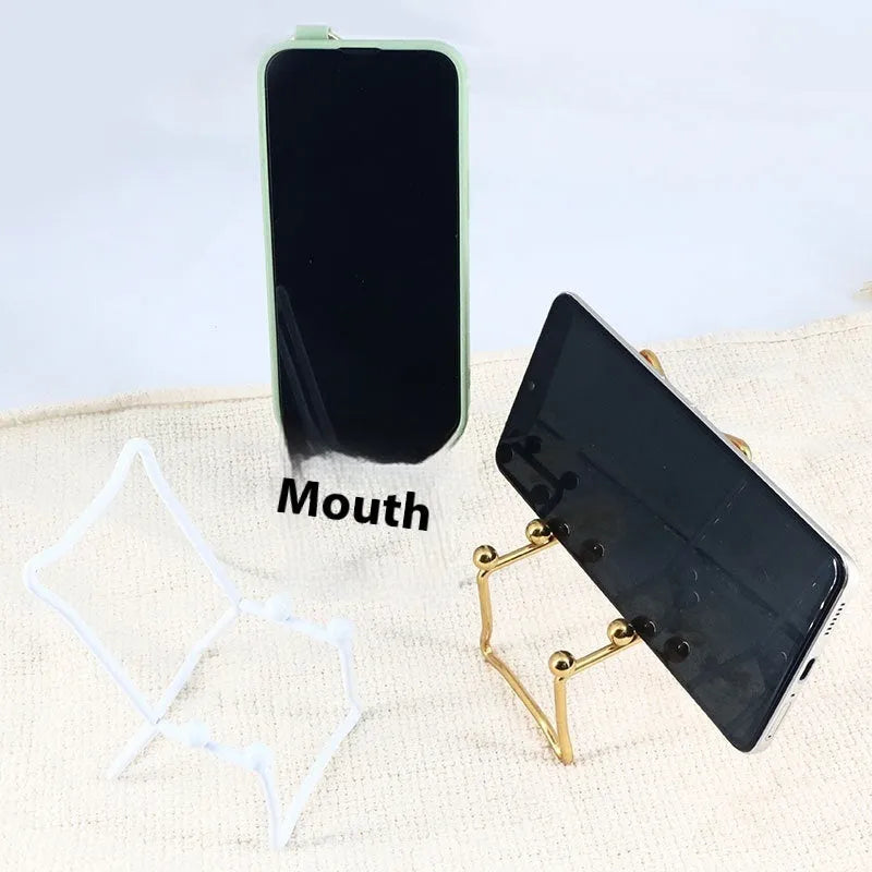 Wrought iron desktop mobile phone bracket in black chair support design on a wooden desk