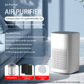 Simple-style desktop air purifier with USB cable and panel heating on a wooden desk.