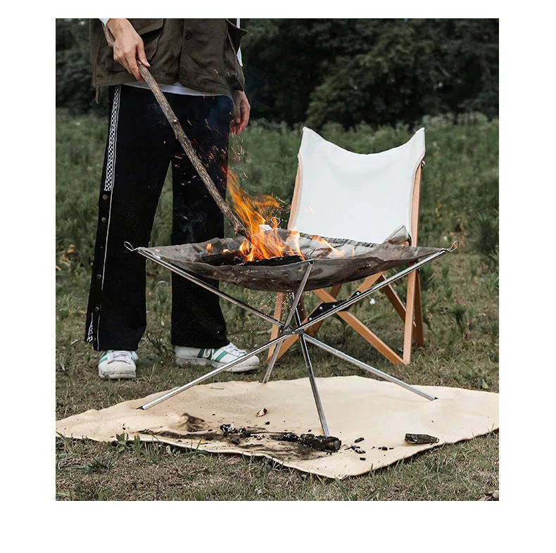 Large stainless steel barbecue with integrated silver grill net for outdoor cooking