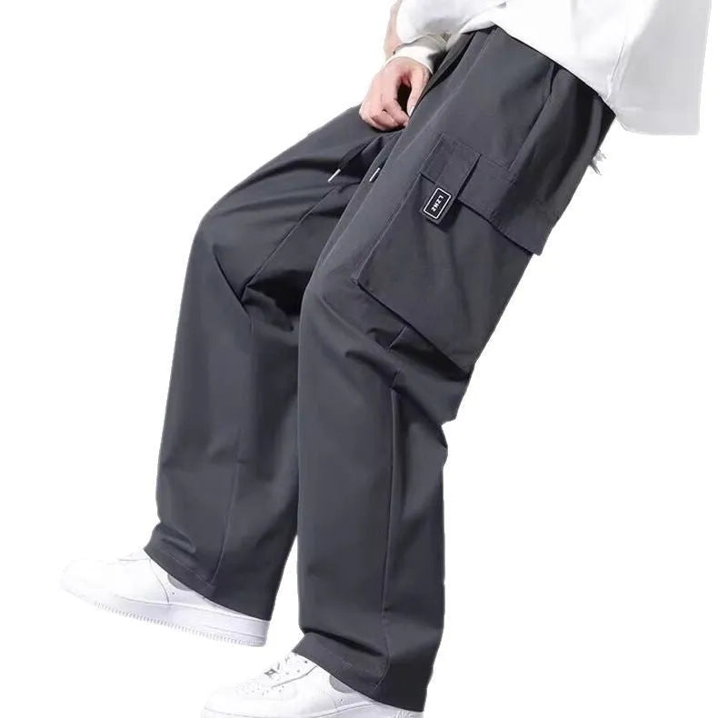 Boys straight leg cargo pants in army green with large pockets and a drawstring waist.