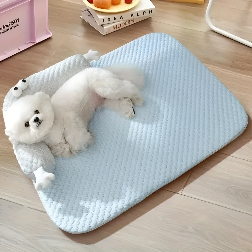 Blue big-eyed monster design pet bed cushion for dogs on a wooden floor.