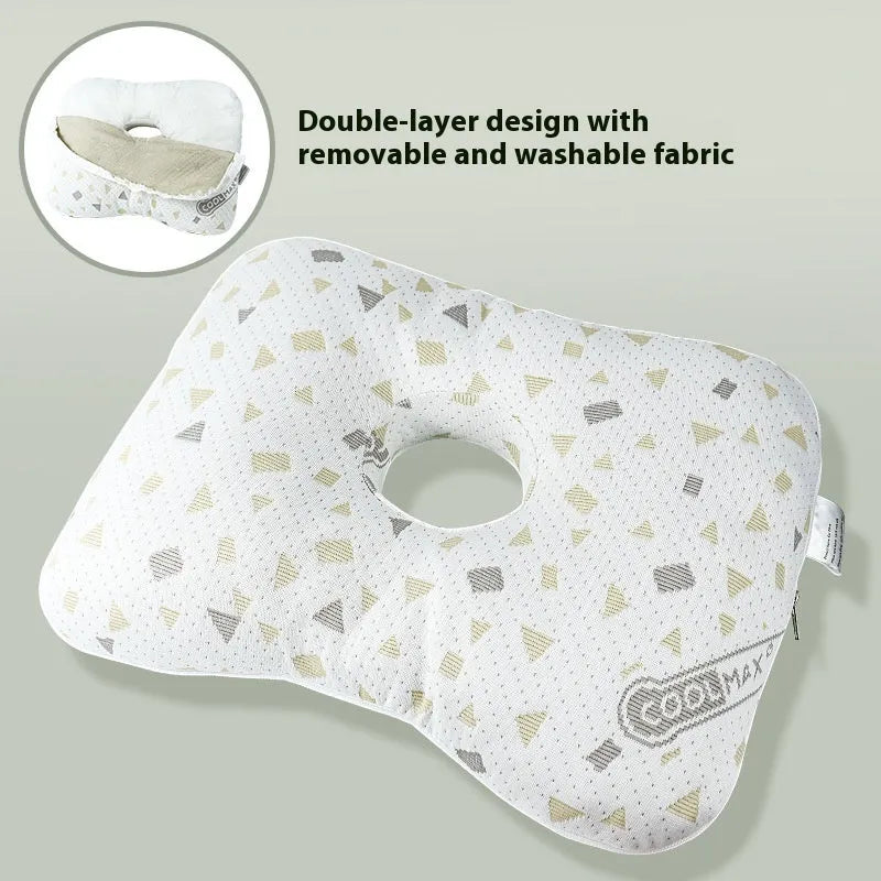 Single hole ear support pillow in grey on a white background, showing its contour and compact size.