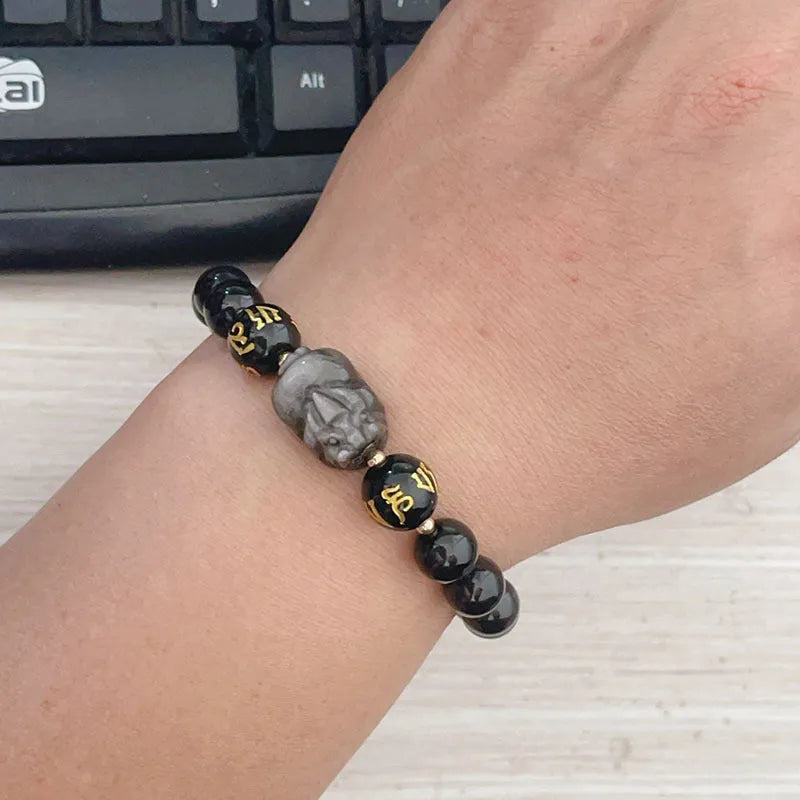 Men's silver stone beaded bracelet with Chinese style and engraved proverbs on a dark background.