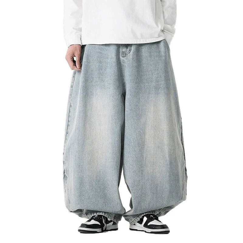 Man wearing plus size light blue wide leg baggy jeans, low waist straight leg casual style.