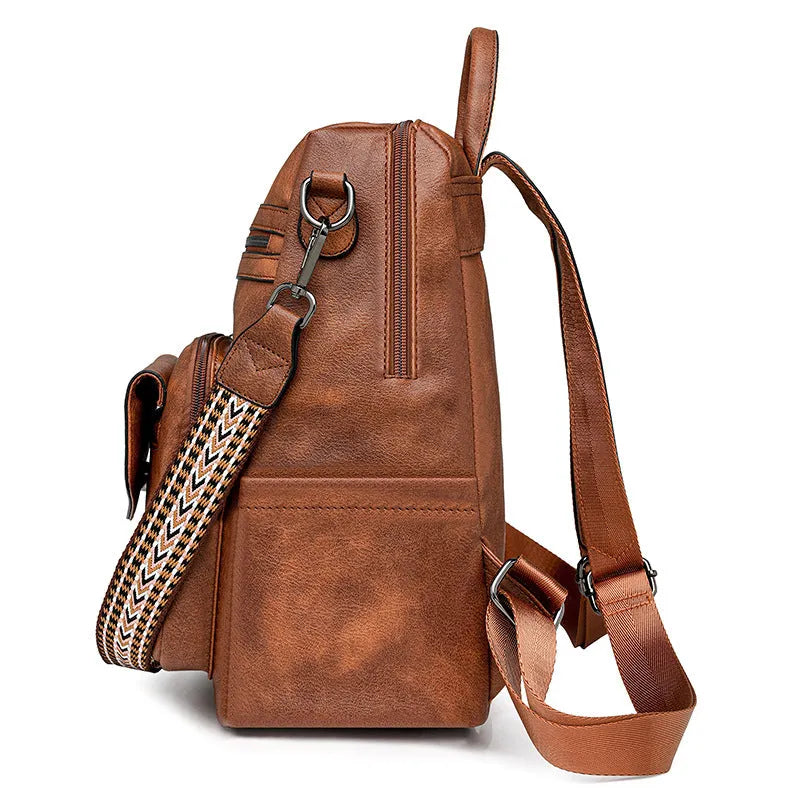 Retro women's backpack with two-tone fringe, soft PU outer, multiple compartments, available in various colours.