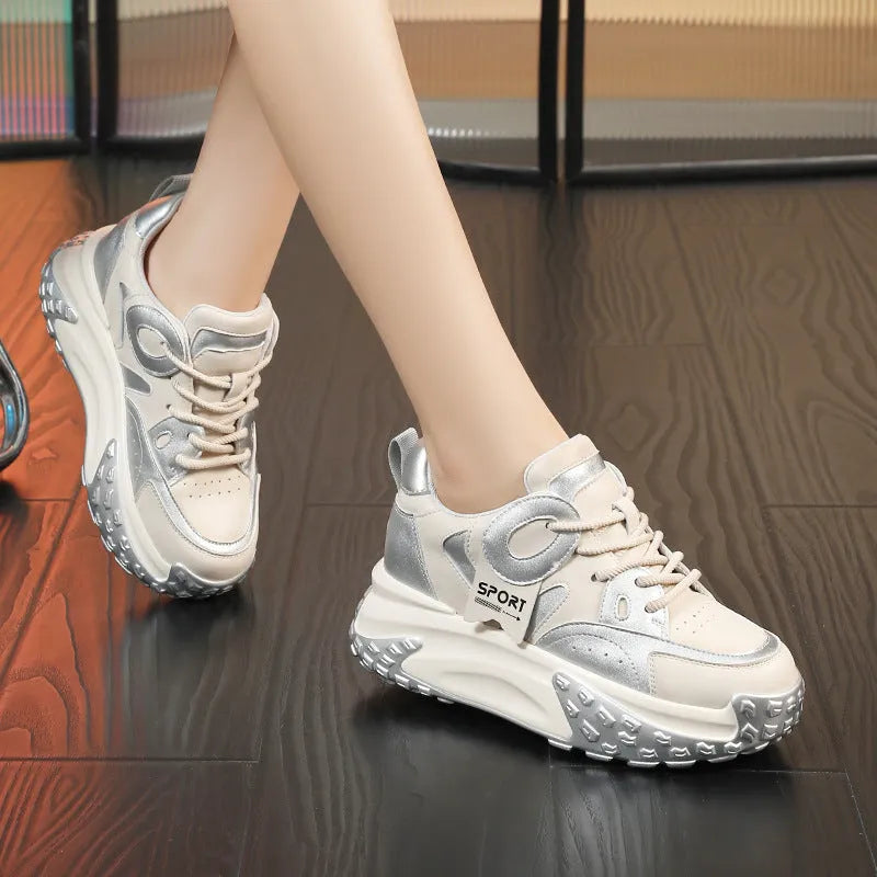 A pair of thick-soled leather sports casual shoes with a wedge heel and lace-up front in a choice of colours.