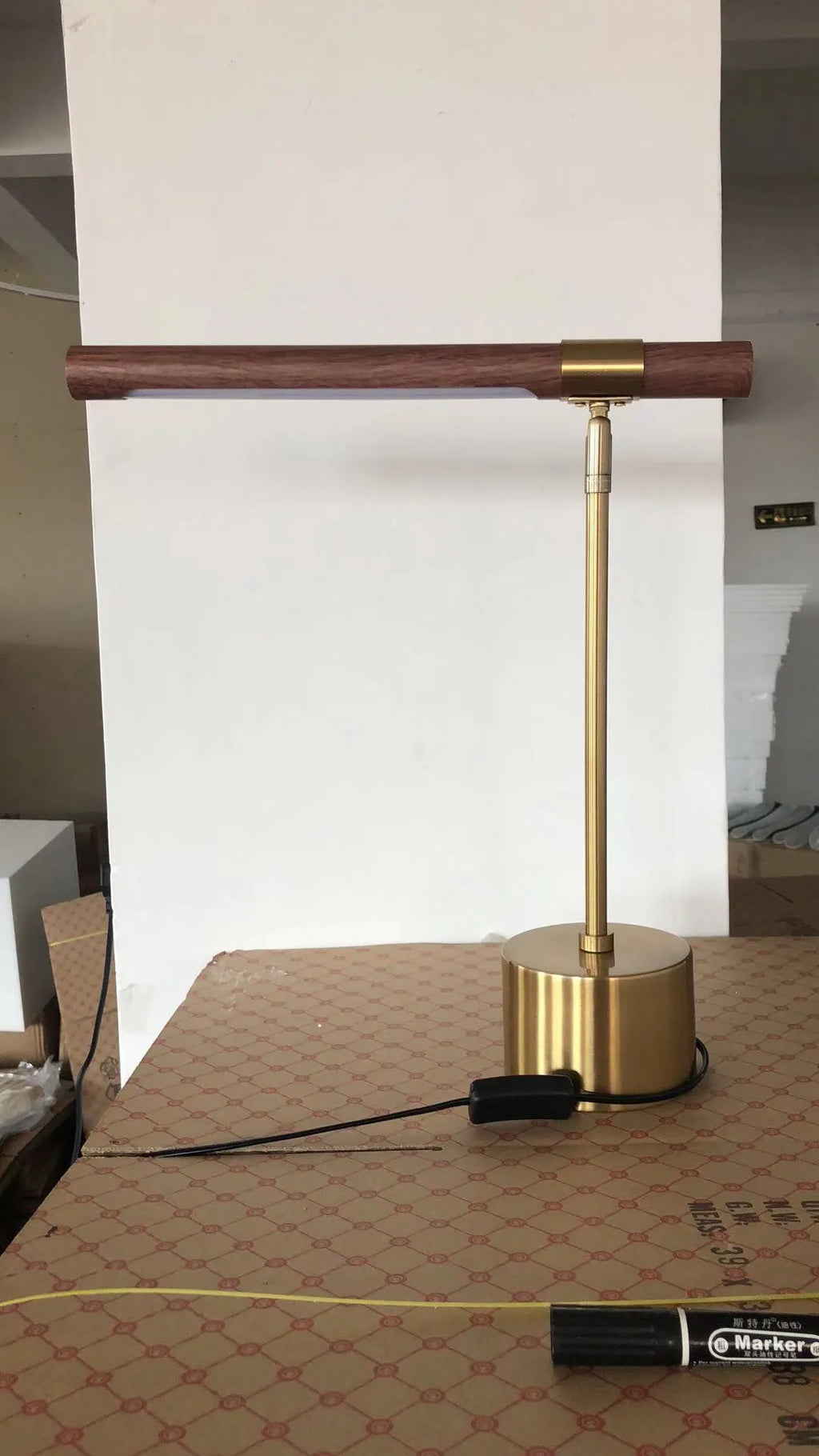 Nordic wood grain desk lamp with iron holder on a white surface, showing warm light and white light modes