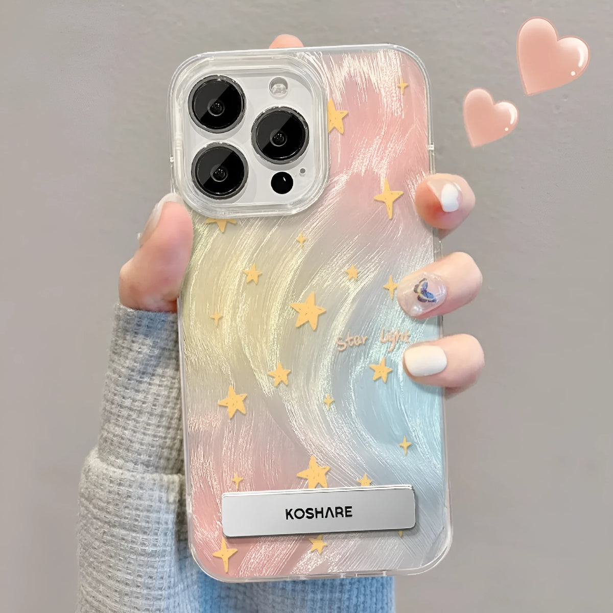 PC phone case for iPhone 15 with silver smudge star design and pop-out bracket on back
